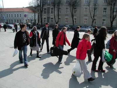 Cathedral Square in Vilnius is the crossroads of many different activities during the day.  Here young musicians and a sister of the Sisters of Mercy make their way to pressing engagements. 